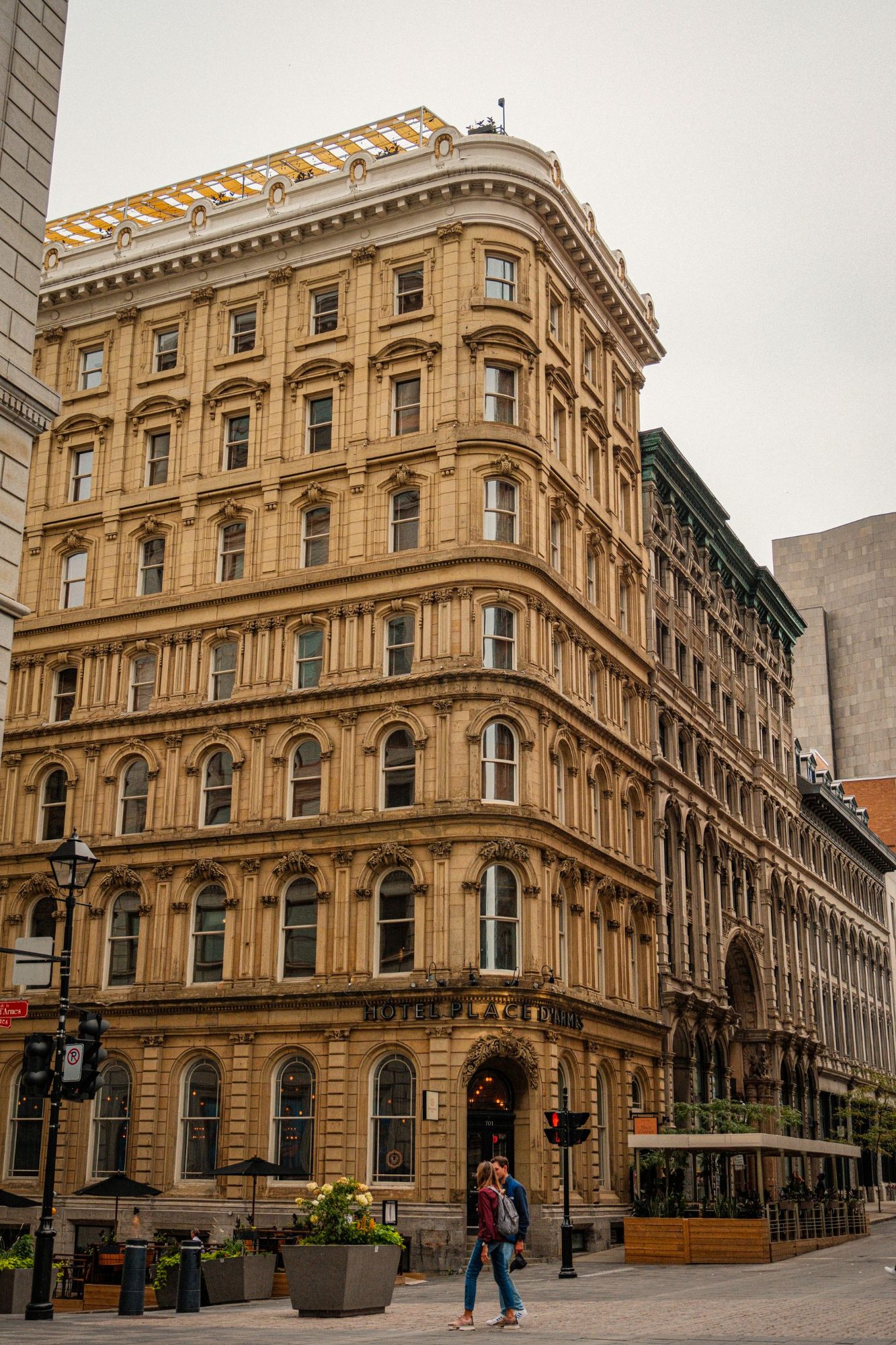 Ornate stone facade of a nineteenth-century building in Old Montréal with rows of tall windows